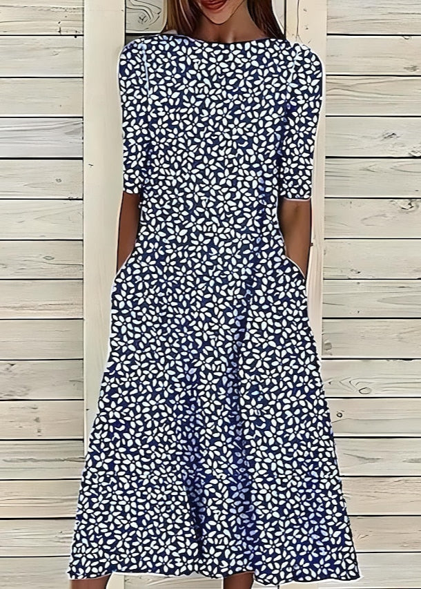 Aurore | Robe midi à fleurs au style romantique avec encolure ronde