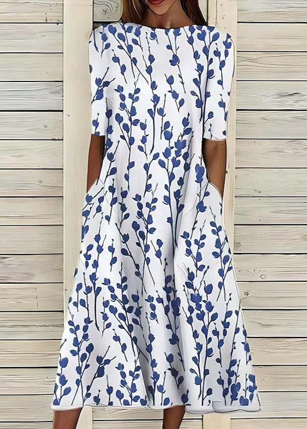 Aurore | Robe midi à fleurs au style romantique avec encolure ronde