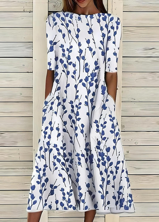 Aurore | Robe midi à fleurs au style romantique avec encolure ronde