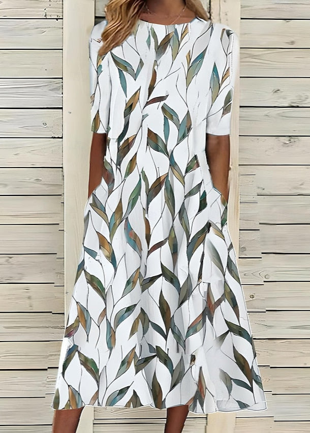 Aurore | Robe midi à fleurs au style romantique avec encolure ronde